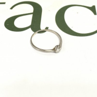 An unmarked diamond solitaire ring, approx weight 1.47 grams. Size V 1/2.