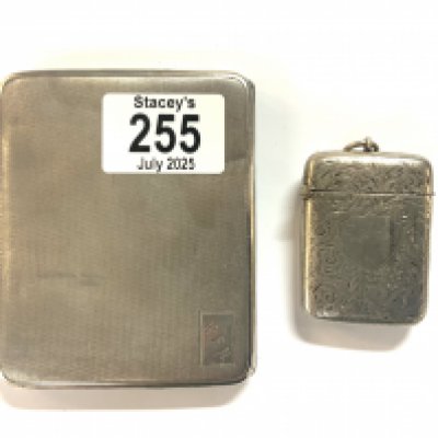 A hallmarked silver cigarette case and vesta case.