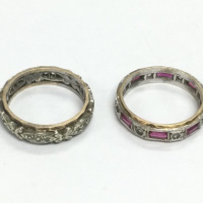 Two stone set eternity rings. Shipping category A.
