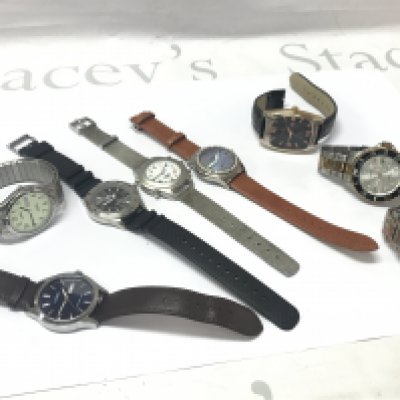 A collection of gents watches , seen in working order . Postage category B