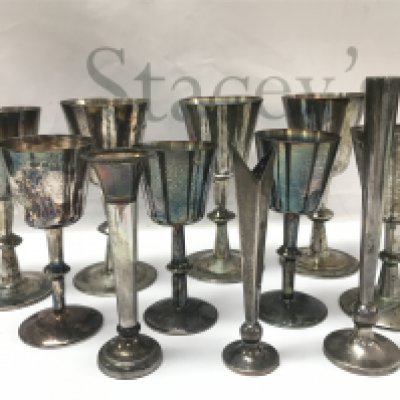 A collection of silver hallmarked Cups (tallest 14cm) and flower vases. Postage category B