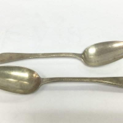 A pair of Georgian silver serving spoons. Shipping category B.