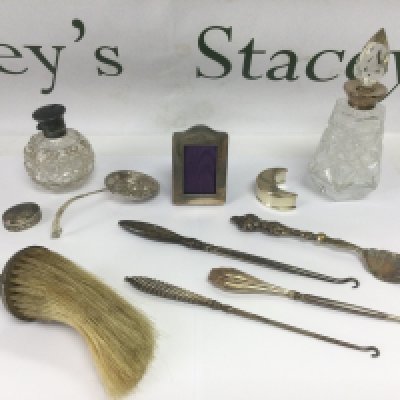 A collection of mixed silver and glass items including a Tiffany half moon shaped box, perfume bottles etc. Shipping category D.