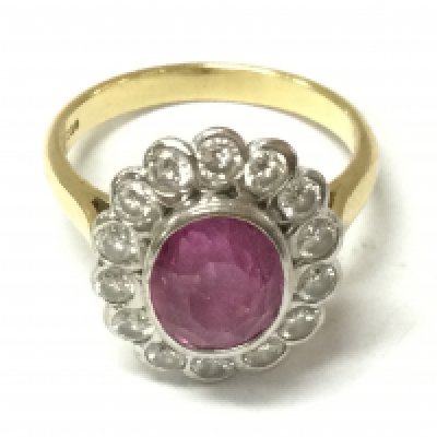 An 18ct gold ring set with pink Topaz. 6.45g and size P.