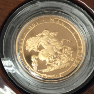 A 2017 gold proof sovereign with box and COA. Postage B
