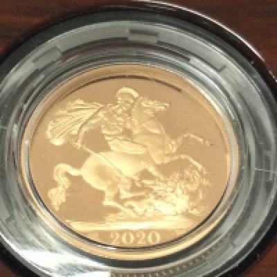 A 2020 gold proof sovereign with box and COA. Postage B