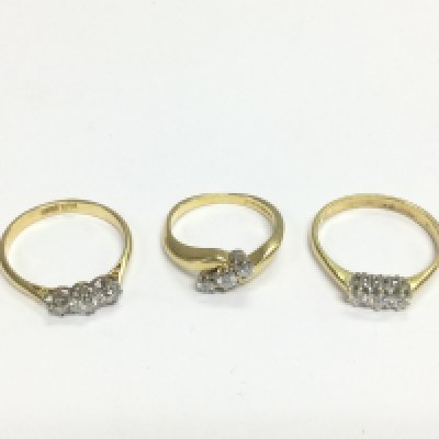 Three 18ct gold three stone diamond rings, approx sizes I-J, O and P. Total approx 8.4g. Shipping category A.