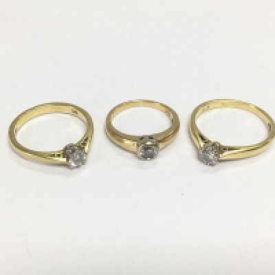 Three 18ct gold solitaire diamond rings, approx sizes H. M and O. Total approx 9g. Shipping category A.