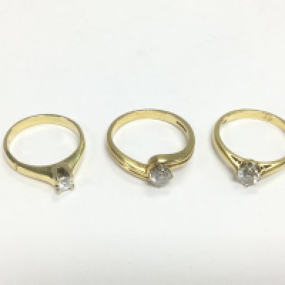 Three 18ct gold diamond solitaire rings, approx sizes J-K, N and O. Total approx 10g. Shipping category A.