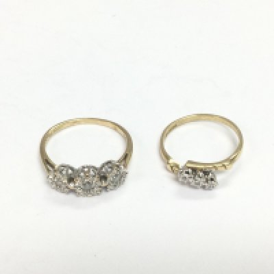 Two 9ct gold three stone diamond rings, approx sizes O and M. Total 3.9g. Shipping category A.