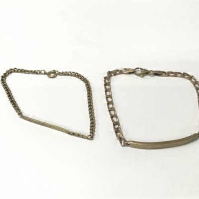A pair of 9ct gold ID bracelet. 11.85g