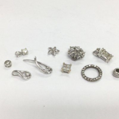 Ten white gold pendants set with diamonds, total approx 9.7g. Shipping category A.