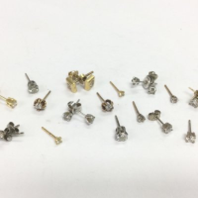 A collection of gold solitaire diamond studs, total approx 10.9g. Shipping category A.