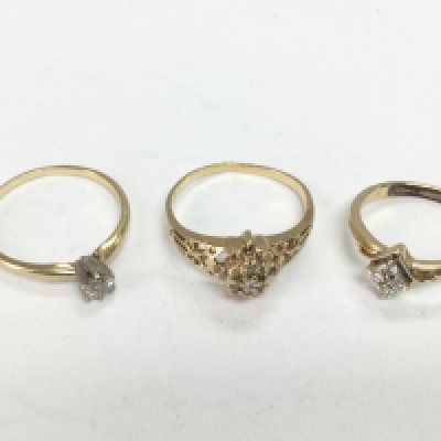 Three gold rings set with diamonds, two 14ct and one unmarked, approx sizes O-P, P and J. Total approx 6.5g. Shipping category A.