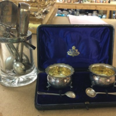 A collection of silver spoons, together with a cased cruet set, and. Glass preserve jar a silver rim