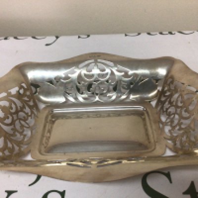 A silver dish with pierced shape sides Sheffield hallmarks maker EV. 28x22cm. Weight 366g.