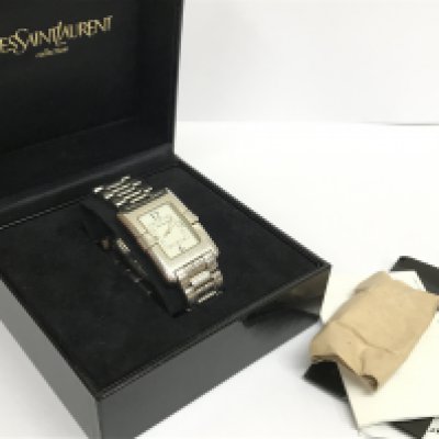 A boxed vintage Gents Yves Saint Laurent watch . Postage category A
