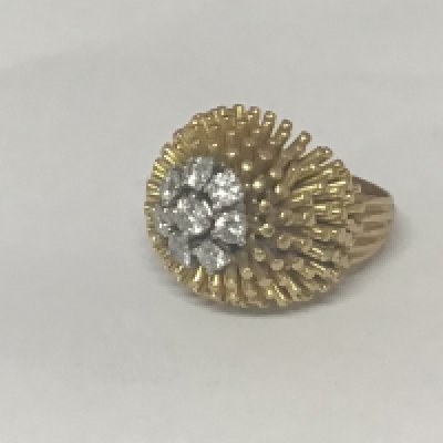A quality 18carat yellow gold modern design ring set with a pattern of eight brilliant cut diamonds of good colour and clarity Weight 17.7g approximately ring size J-K