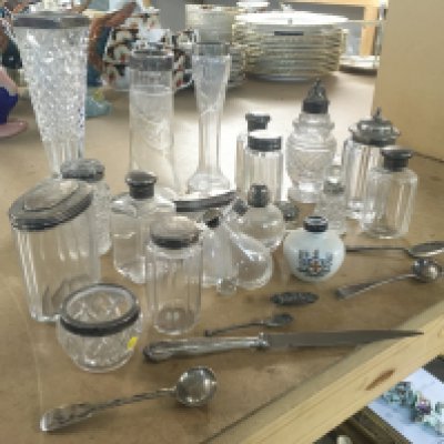 A collection of cut glass vases and containers with silver colllars and lids. Silver spoons and paper knife. This lot cannot be posted