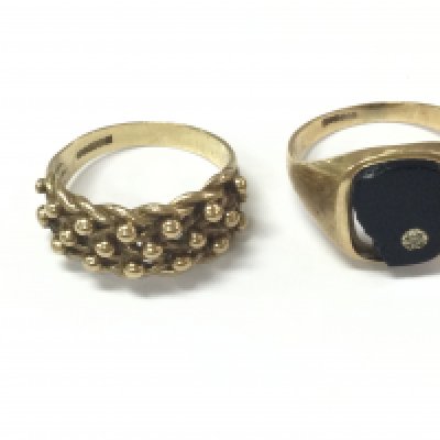 Two 9ct gold gents rings. 8.38g