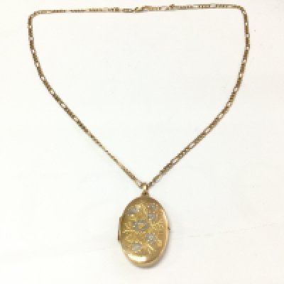 A 9ct gold chain and 9ct locket. 12.33g Postage B