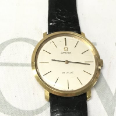 A gent omega de ville watch seen working on a black leather strap. Postage B