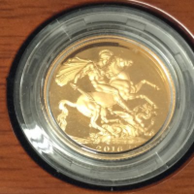 A 2016 gold proof sovereign with box and COA.Postage B