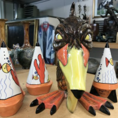 A large Lorna Bailey figurine of a Pelican. Height 28cm, limited edition 33/50- signed on the base. Together with three Lorna Bailey "Aqua " pattern sugar shakers.