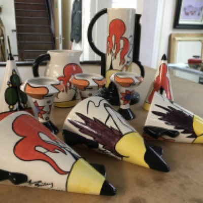 Lorna Bailey items, including wall pockets, vase, jug, miniature vases and two sugar shakers. (Patterns include "House and Path and "The Dingle Porthill")