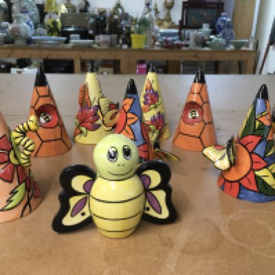 Six Lorna Bailey insect themed Sugar shakers, together with a Bee shaped one