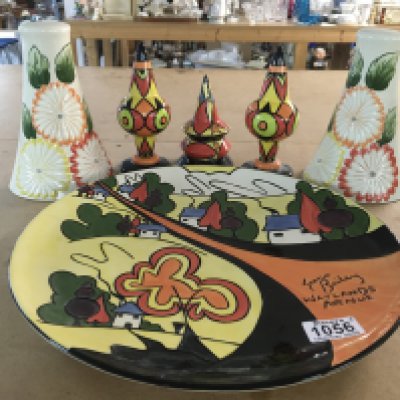 Six Lorna Bailey pottery pieces including Watlands Avenue limited edition 72/100 plaque, a pair of floral wall pockets, limited edition sugar shakers 2/50 and 3/50 and a Bewitched pattern sugar shaker