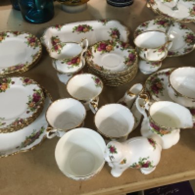 A Royal Albert tea and part dinner service tea pot coffee pot plates a two tier cake stand vase and other Royal Albert ornaments. No Obvious damage.