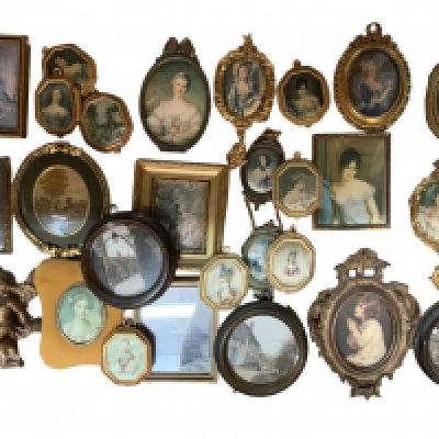 A collection of gilt framed miniature pictures.
