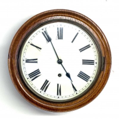 A small oak cased wall clock. 33cm diameter.