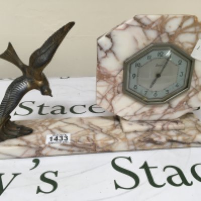 An Art Deco French Marble mantel clock surmounted with a flying bird. Length 41cm- NO RESERVE