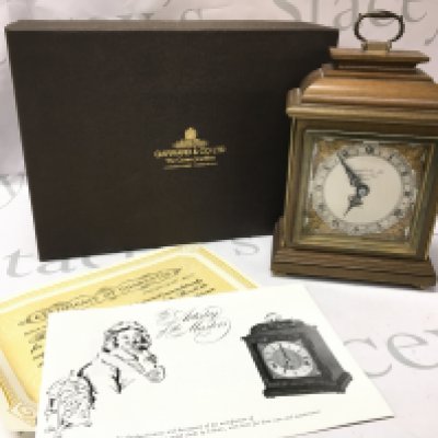 A boxed Garrard mantle clock . Postage category C