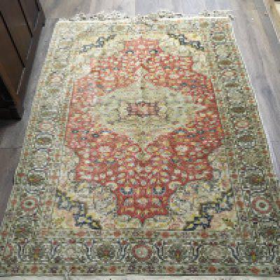 A part silk Persian rug, dimensions 138cm wide 194cm long