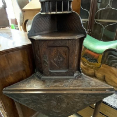 A small carved oak corner desk with drop flap front. 137cm x 55cm