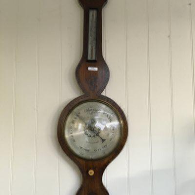 A Victorian rosewood barometer with brass inlay, with silver dial. Maker -Glazier Chelmsford