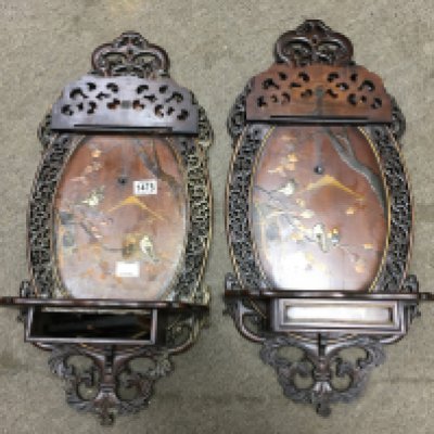 A pair of Victorian mahogany wall brackets inlaid with oriental scenes, with single shelf. 70cm x 32cm