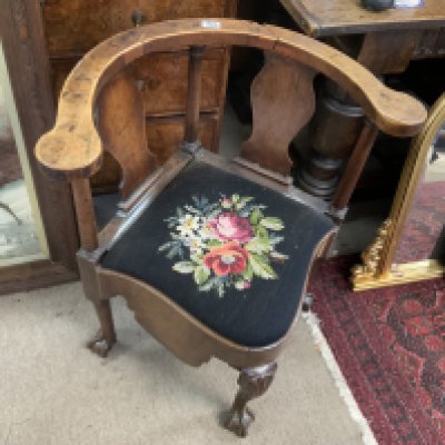 A George III mahogany corner chair, damage to top rail.