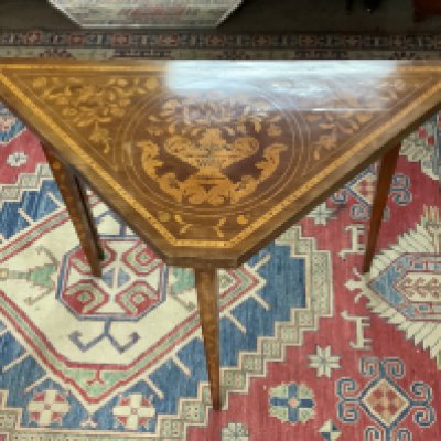A 19th century mahogany and Dutch marquetry envelope card table.