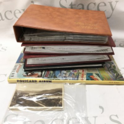 A collection of postcards in albums and some loose cards . Postage category B- NO RESERVE
