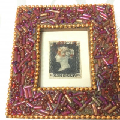 A framed penny black stamp . Postage category a