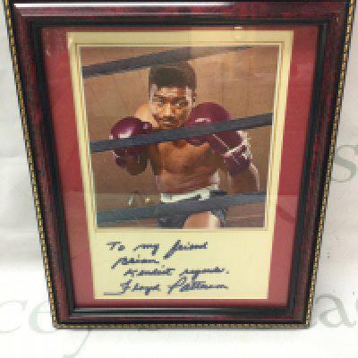A Floyd Patterson signed autograph , frame dimensions 24x29cm .