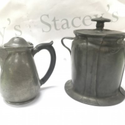 A Liberty Tudric Pewter biscuit barrel (Approx 18cm) and a damaged Tudric jug (14cm tall). Postage category C