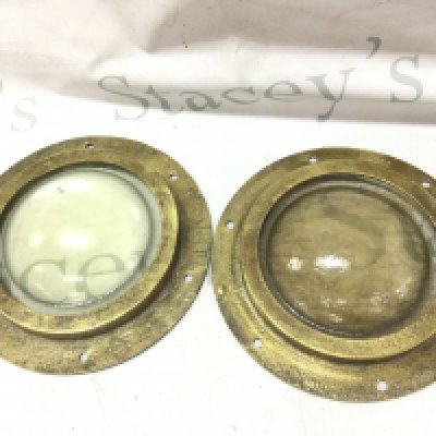 Two vintage brass portholes , thick glass. 22cm wide. This lot cannot be posted- NO RESERVE