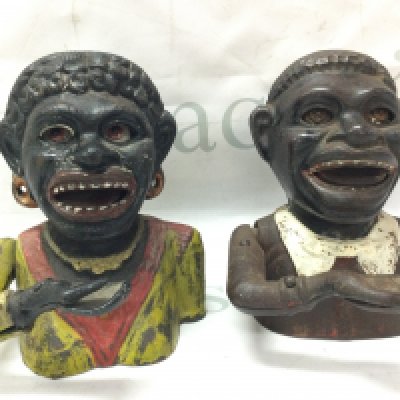 Two vintage cast iron money boxes . Postage category C