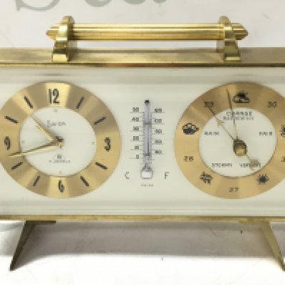 A vintage Swiza 8 day 7 jewels clock with mercury therometer barometer solid brass (working)