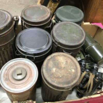 A collection of German gas mask cans , Bristol gas lamp cans, binoculars. no reserve
